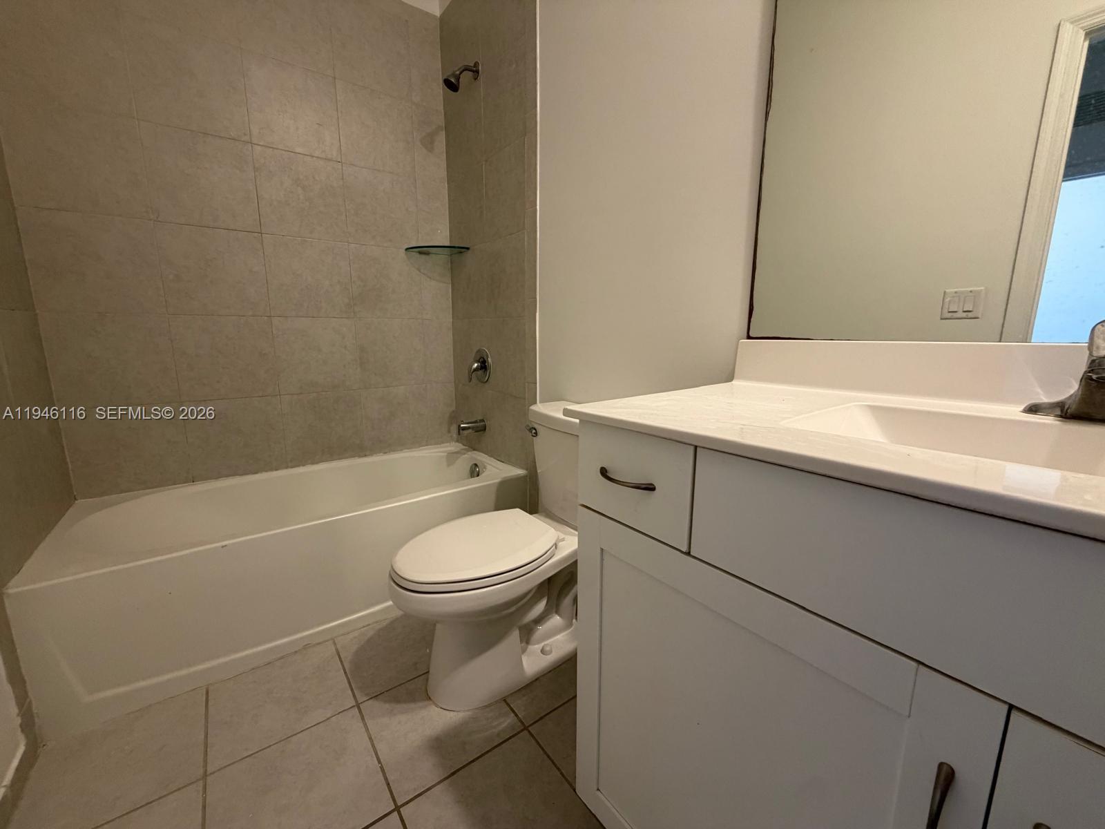3326 West 112th Street Hialeah, FL 33018 - Photo 25 of 37 a bathroom with a sink a toilet and shower