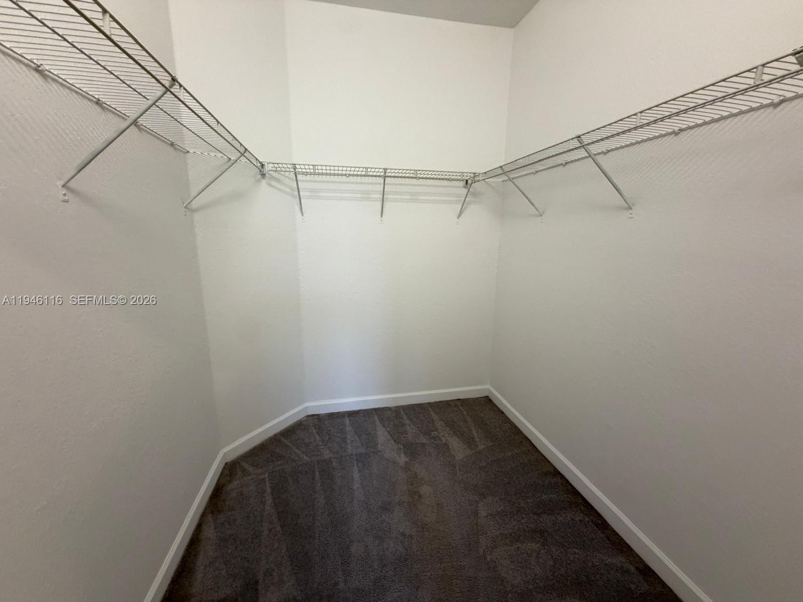 3326 West 112th Street Hialeah, FL 33018 - Photo 27 of 37 a view of a room with racks on the wall