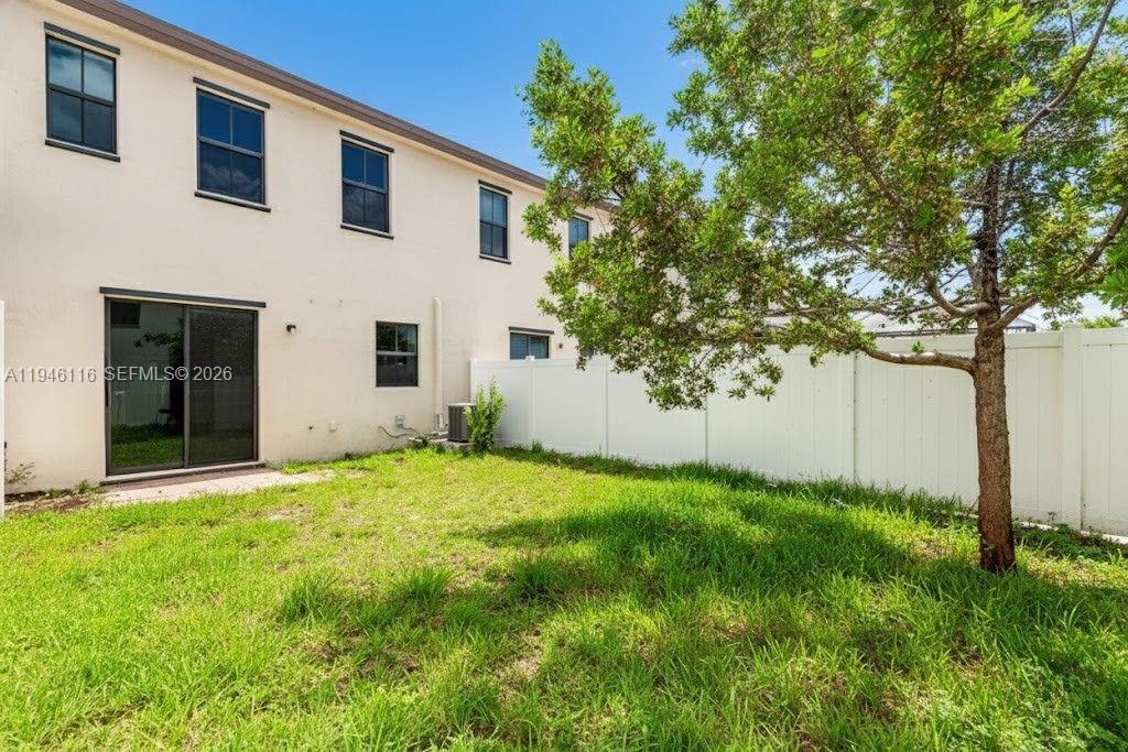 3326 West 112th Street Hialeah, FL 33018 - Photo 29 of 37 a view of backyard of house with green space