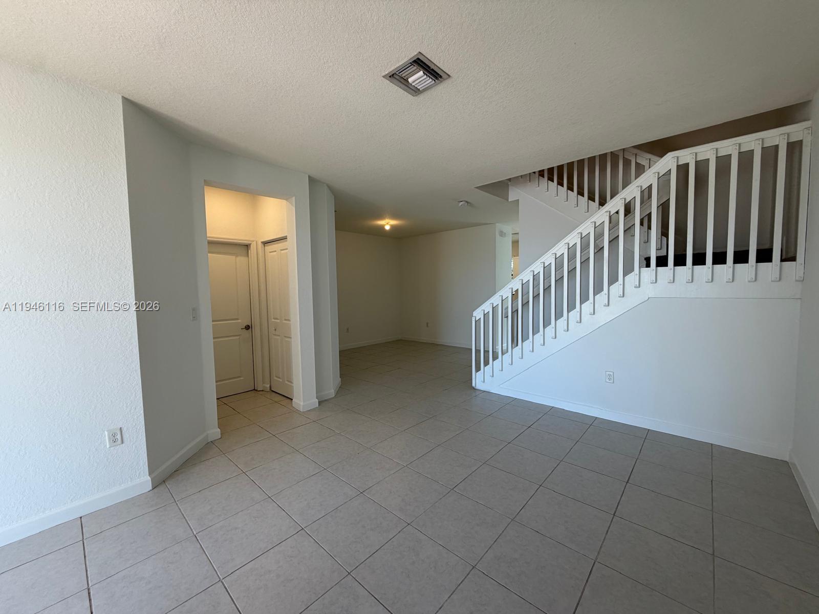 3326 West 112th Street Hialeah, FL 33018 - Photo 3 of 37 a view of an entryway with a window