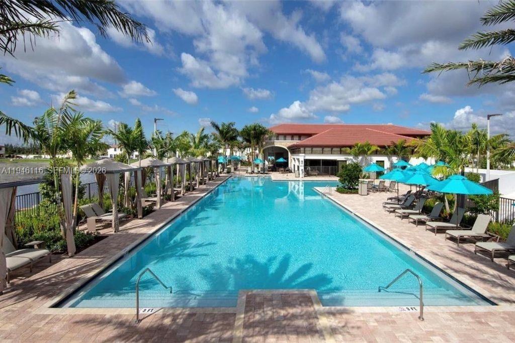3326 West 112th Street Hialeah, FL 33018 - Photo 32 of 37 a view of a swimming pool with a patio
