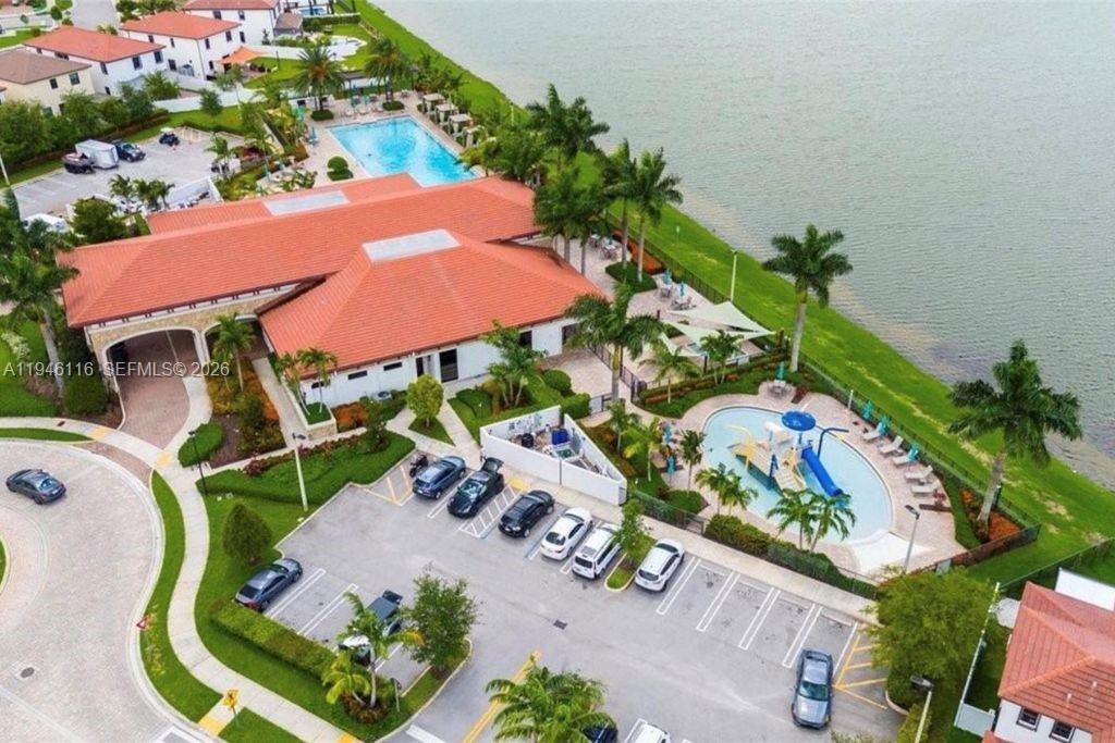 3326 West 112th Street Hialeah, FL 33018 - Photo 36 of 37 an aerial view of a house with a swimming pool patio and outdoor seating