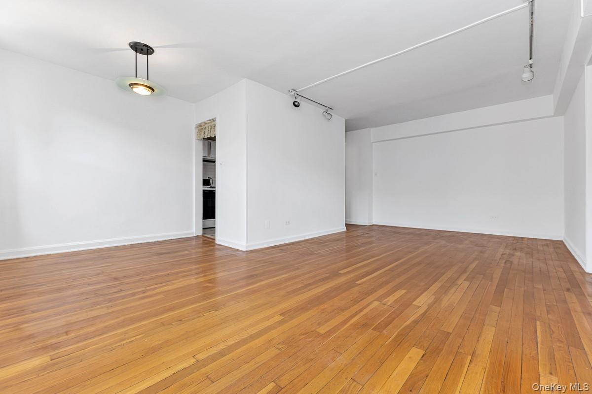 105-25 67th Road, Unit 4A Queens, NY 11375 - Photo 2 of 7 Living Room and Dining