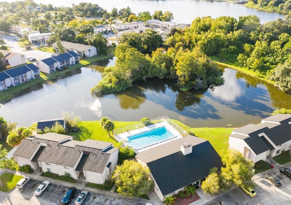 an aerial view of residential houses with outdoor space