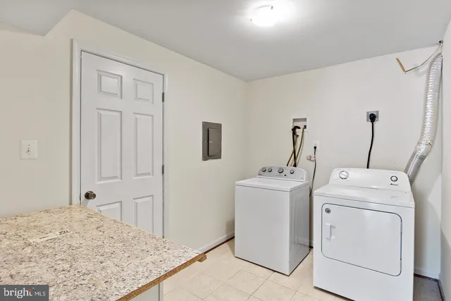 a view of bathroom with a washer and dryer