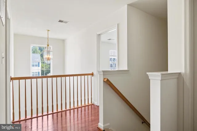 a view of a hallway with windows