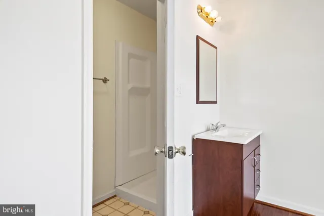 a view of a bathroom from a hallway