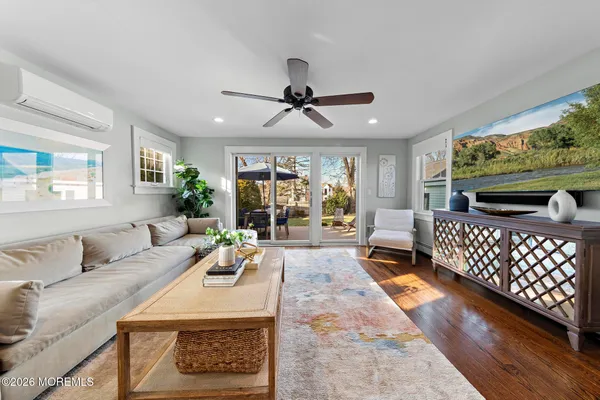 a living room with furniture fireplace and a flat screen tv
