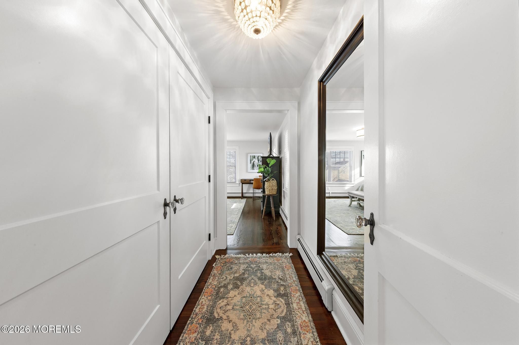 49 Jackson Street Fair Haven, NJ 07704 - Photo 19 of 42 a view of a hallway with wooden floor and staircase