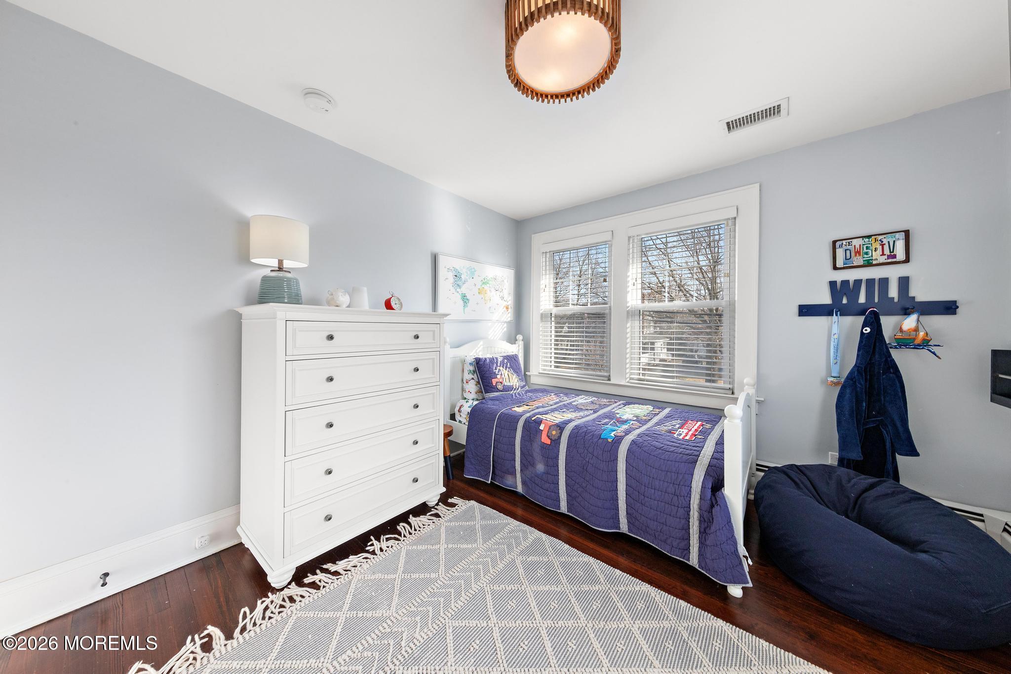 49 Jackson Street Fair Haven, NJ 07704 - Photo 25 of 42 a bedroom with a bed and window