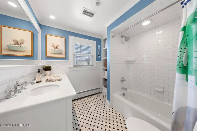 a bathroom with a bathtub sink vanity and mirror