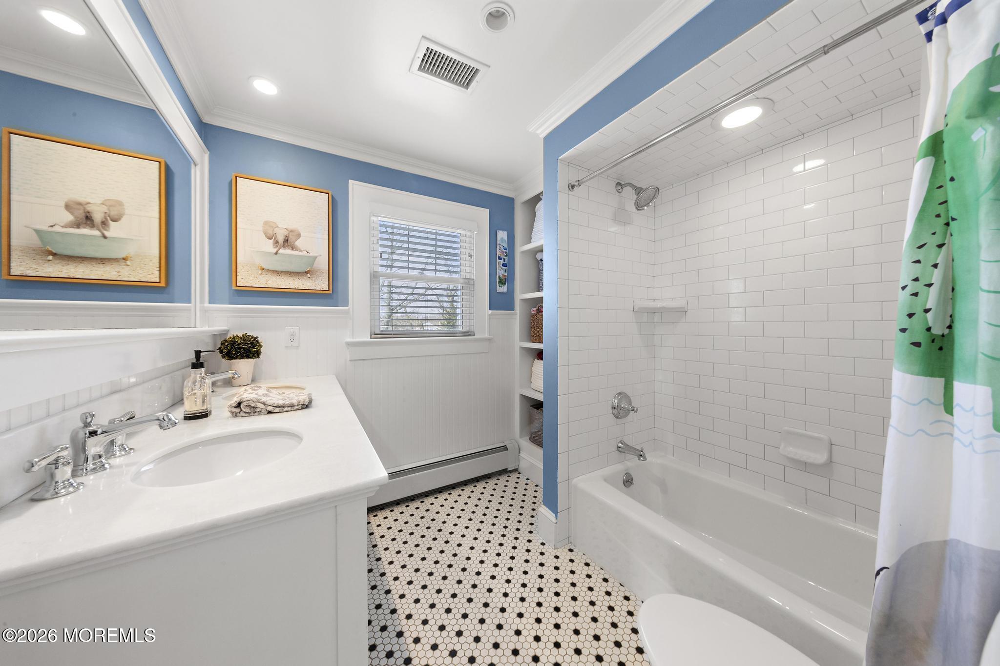 49 Jackson Street Fair Haven, NJ 07704 - Photo 29 of 42 a bathroom with a bathtub sink vanity and mirror