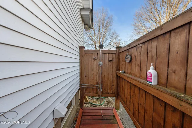 a view of a balcony with wooden walls