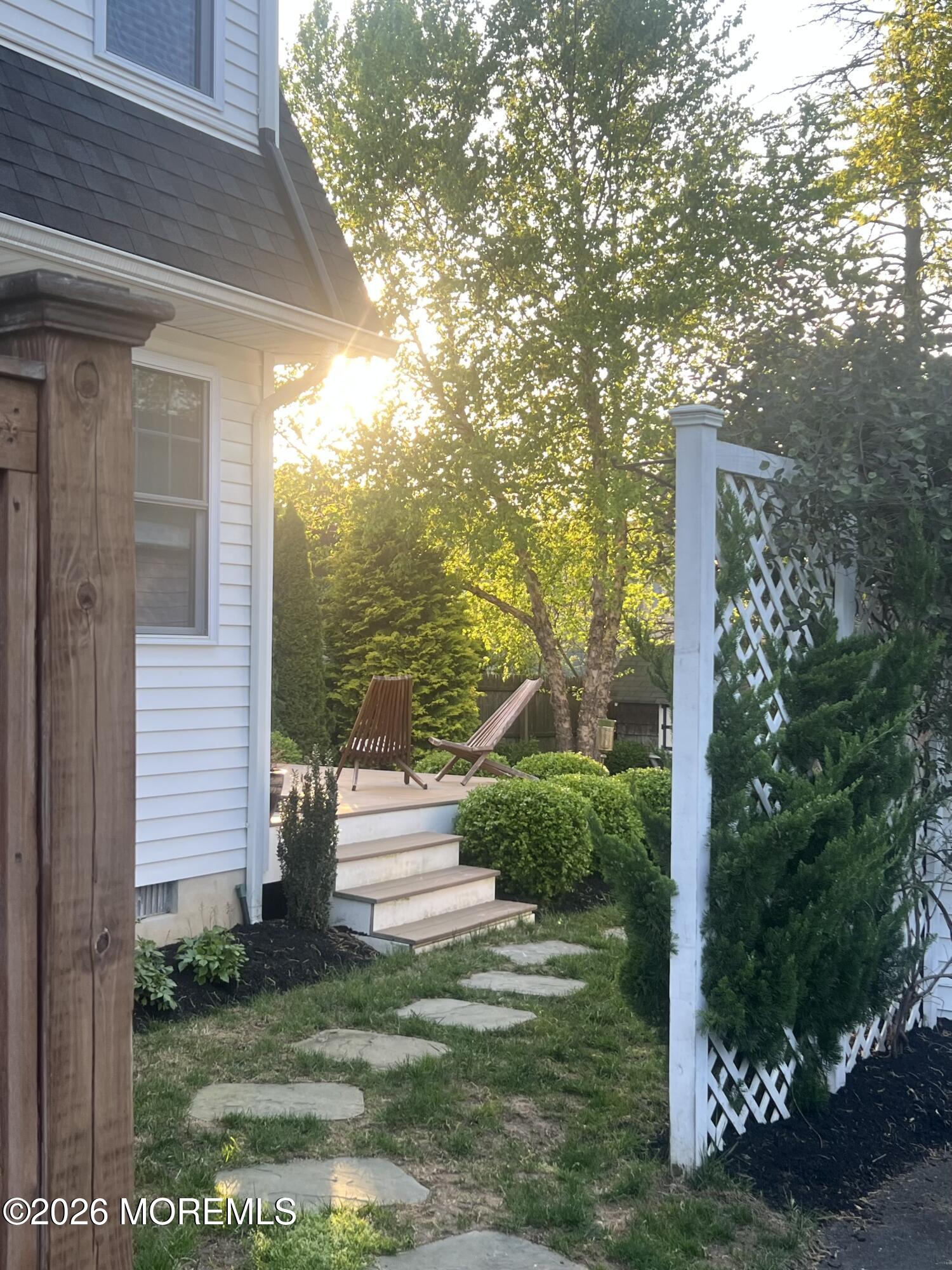 49 Jackson Street Fair Haven, NJ 07704 - Photo 35 of 42 a view of a yard with plants and large trees