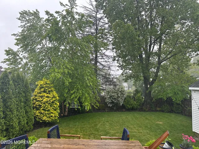 a view of a lake with a yard