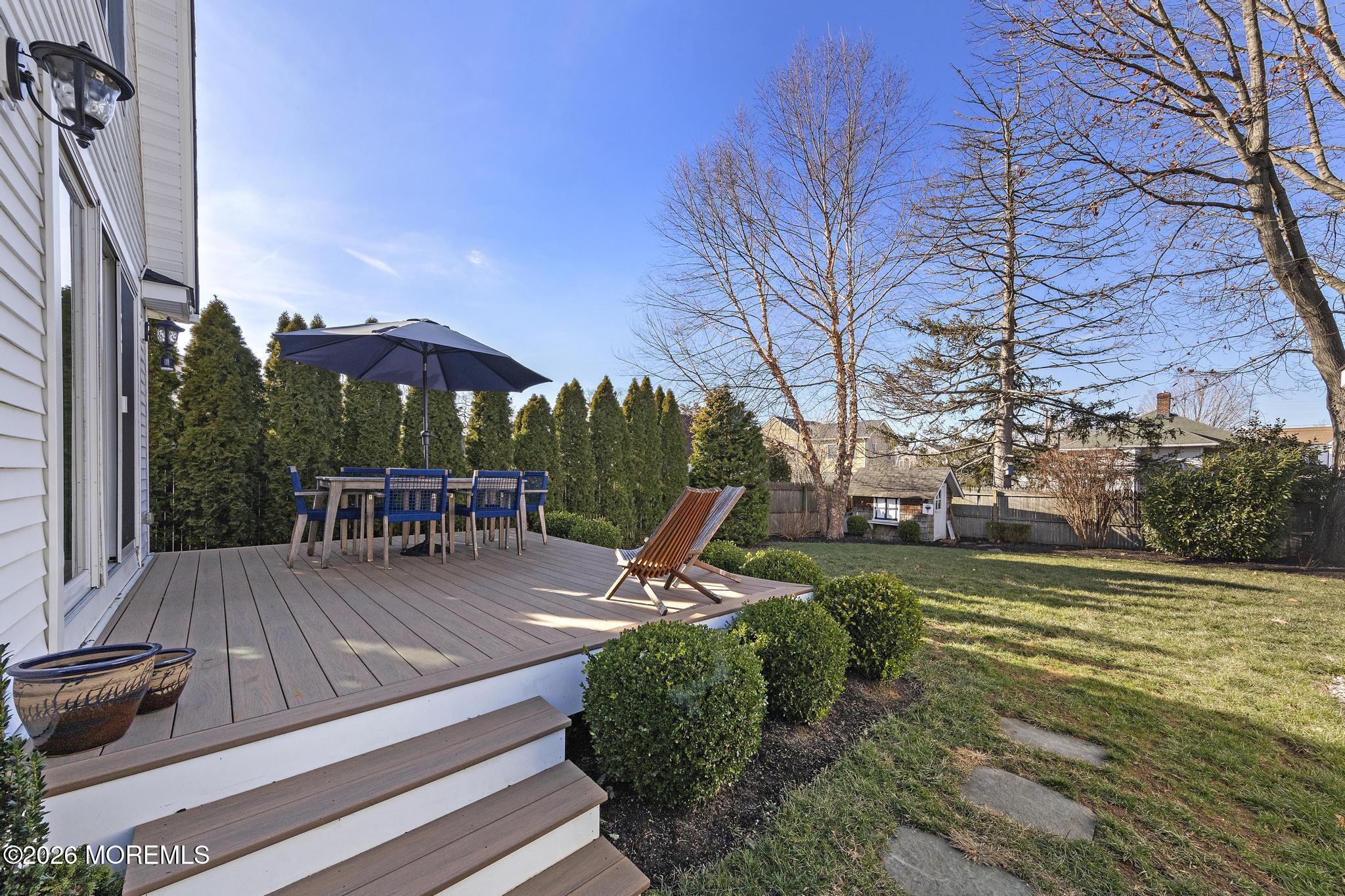 49 Jackson Street Fair Haven, NJ 07704 - Photo 39 of 42 a view of a swimming pool with a patio and a yard
