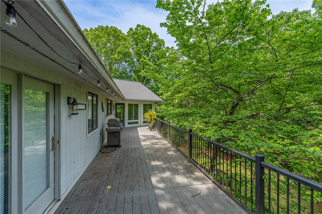 118 Beacon Ridge Circle Salem, SC 29676 - Photo 29 of 45 An inviting deck extends into a lush, green landscape, offering serene outdoor living.