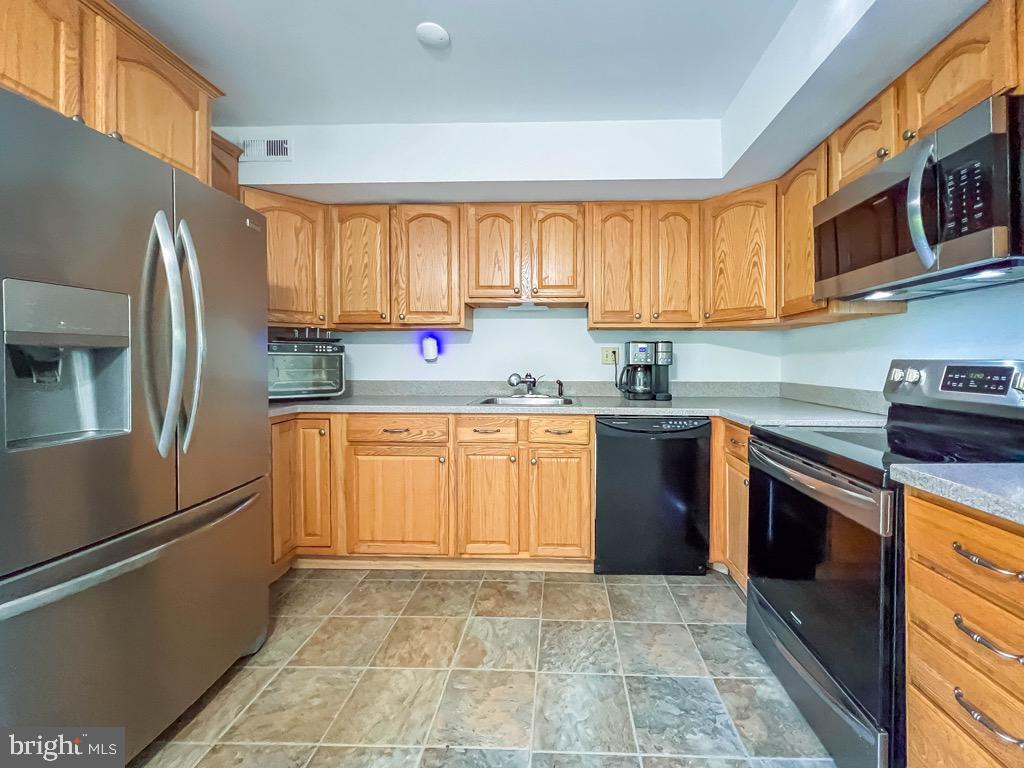 3470 East Gate Place Holland, PA 18966 - Photo 5 of 35 Large kitchen with pantry cabinet