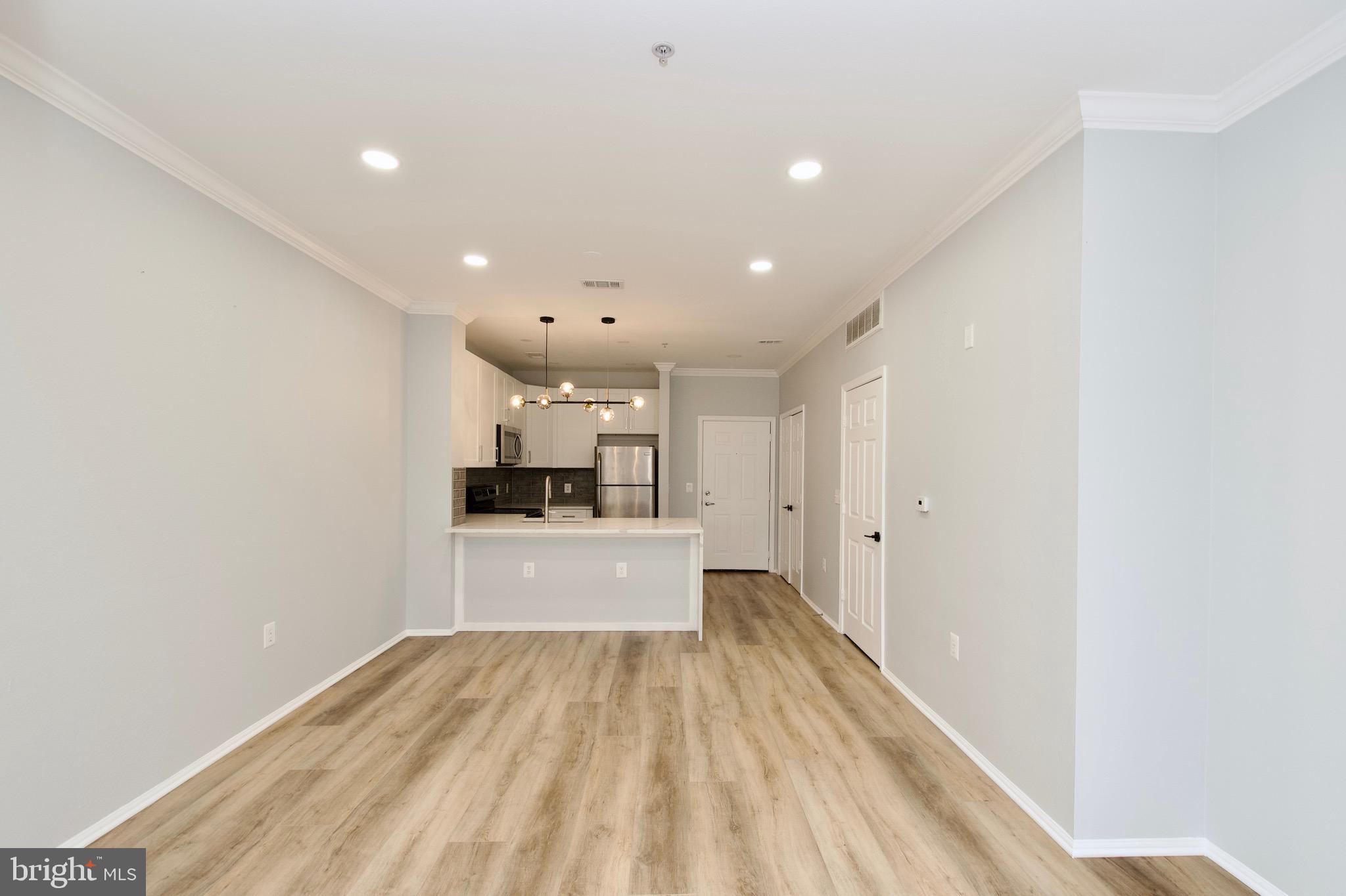 3003 Nicosh Circle, Unit 3106 Falls Church, VA 22042 - Photo 14 of 25 a view of a kitchen with a sink and cabinets