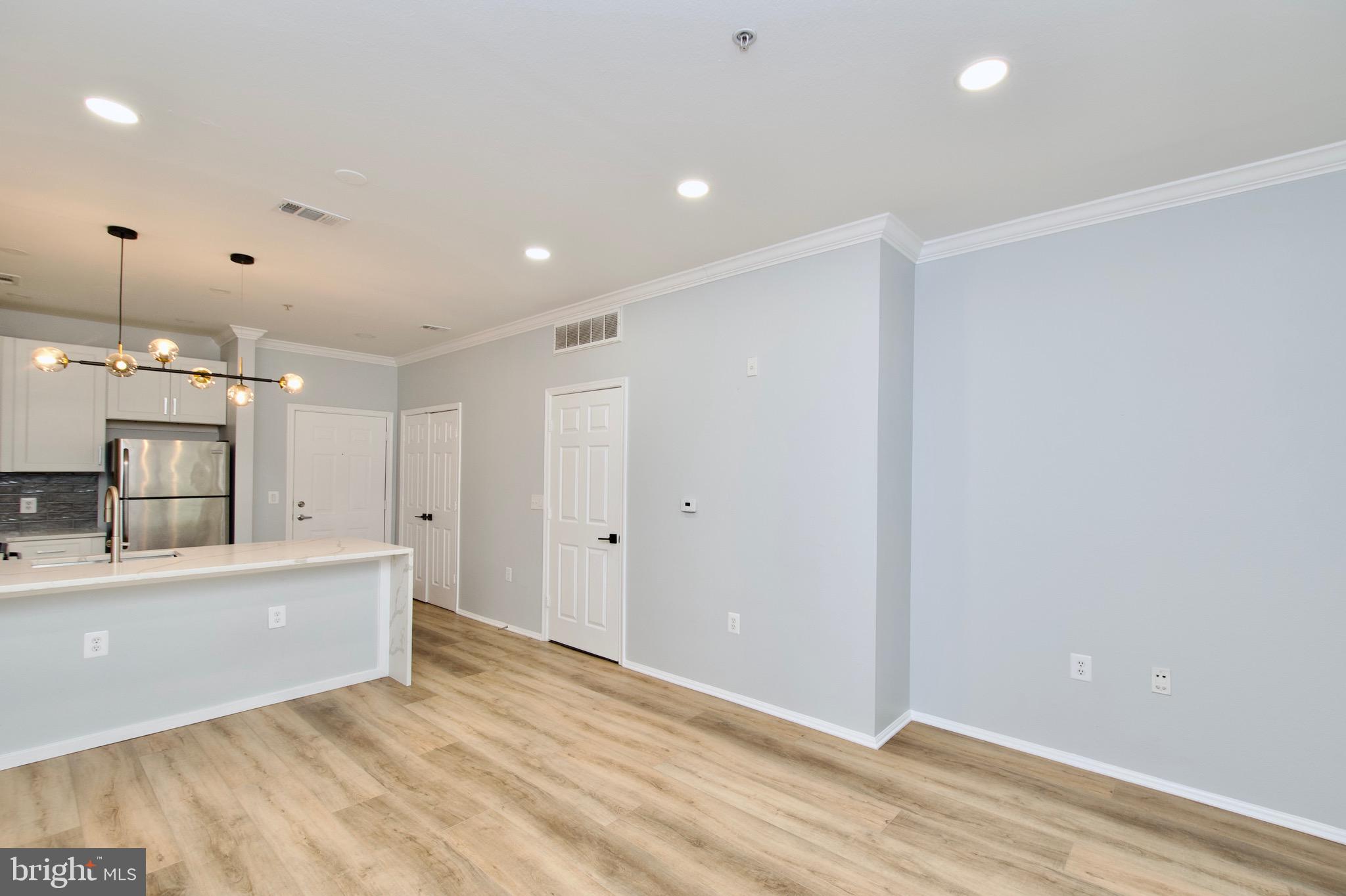 3003 Nicosh Circle, Unit 3106 Falls Church, VA 22042 - Photo 15 of 25 a view of a kitchen with a sink and a refrigerator