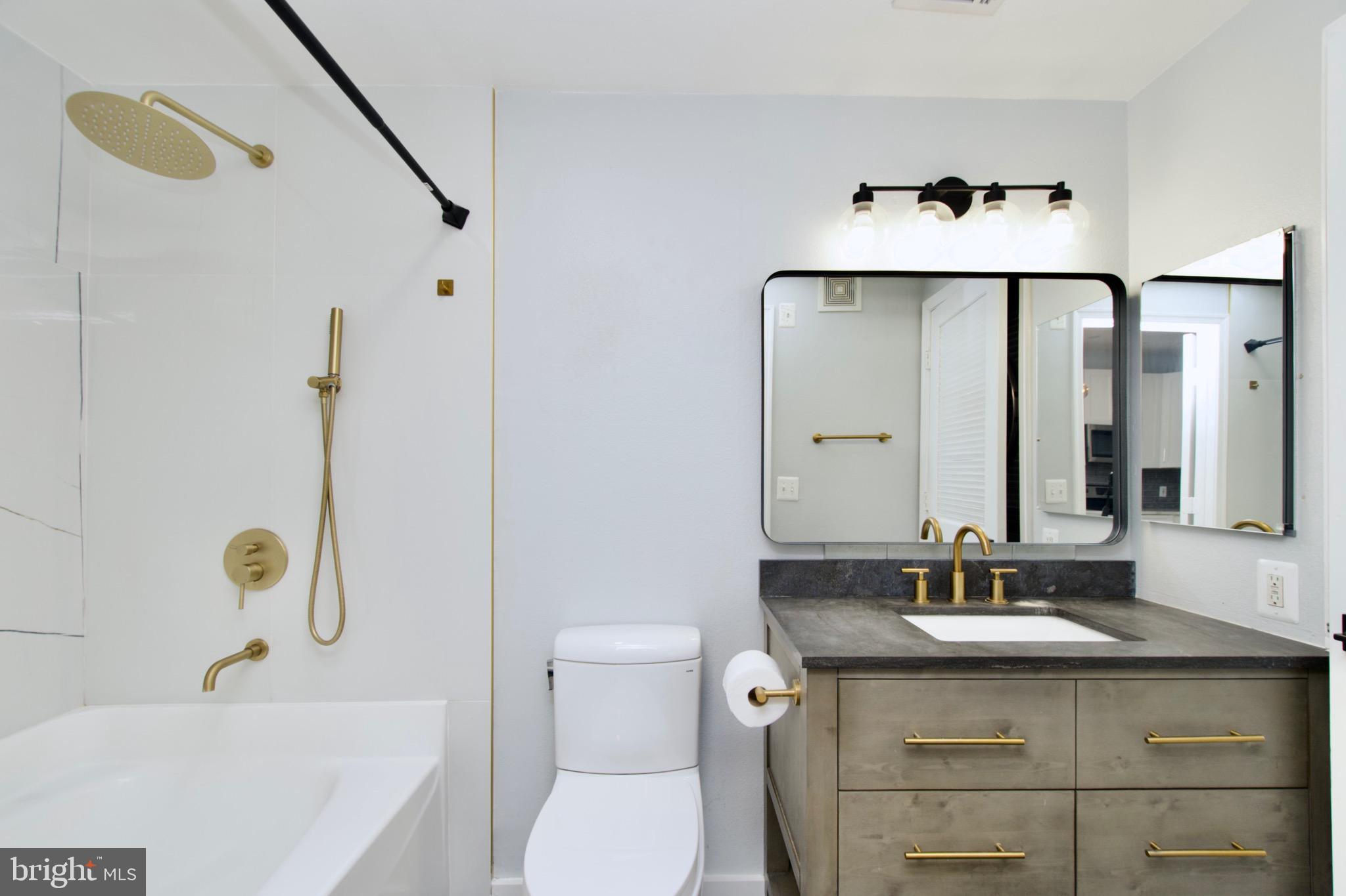 3003 Nicosh Circle, Unit 3106 Falls Church, VA 22042 - Photo 19 of 25 a bathroom with a sink toilet and shower