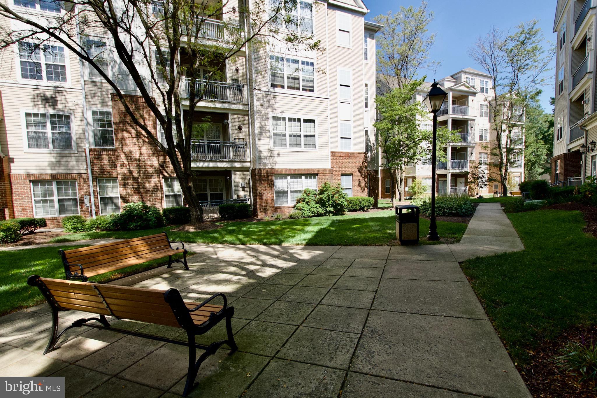3003 Nicosh Circle, Unit 3106 Falls Church, VA 22042 - Photo 25 of 25 a view of a building with garden and sitting area