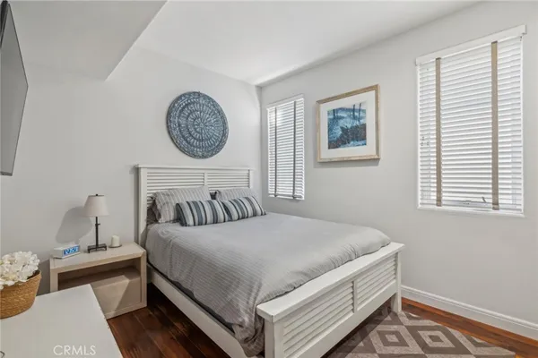 a bedroom with a bed and a table