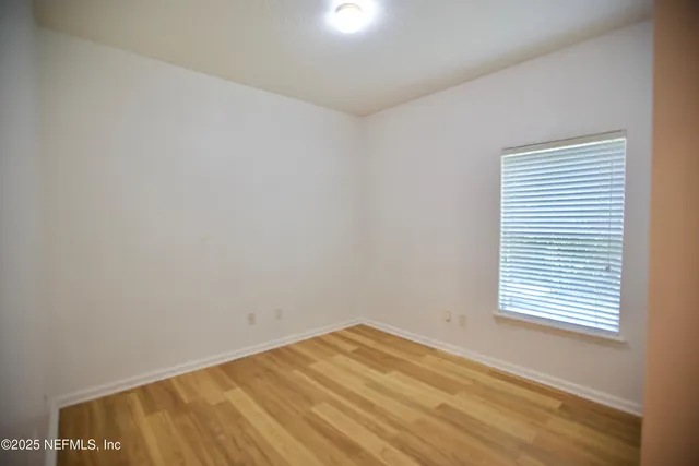 a view of a room with a window