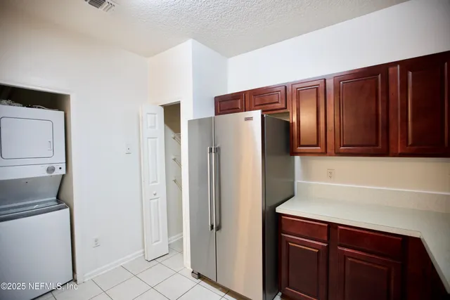a white refrigerator freezer sitting in a kitchen