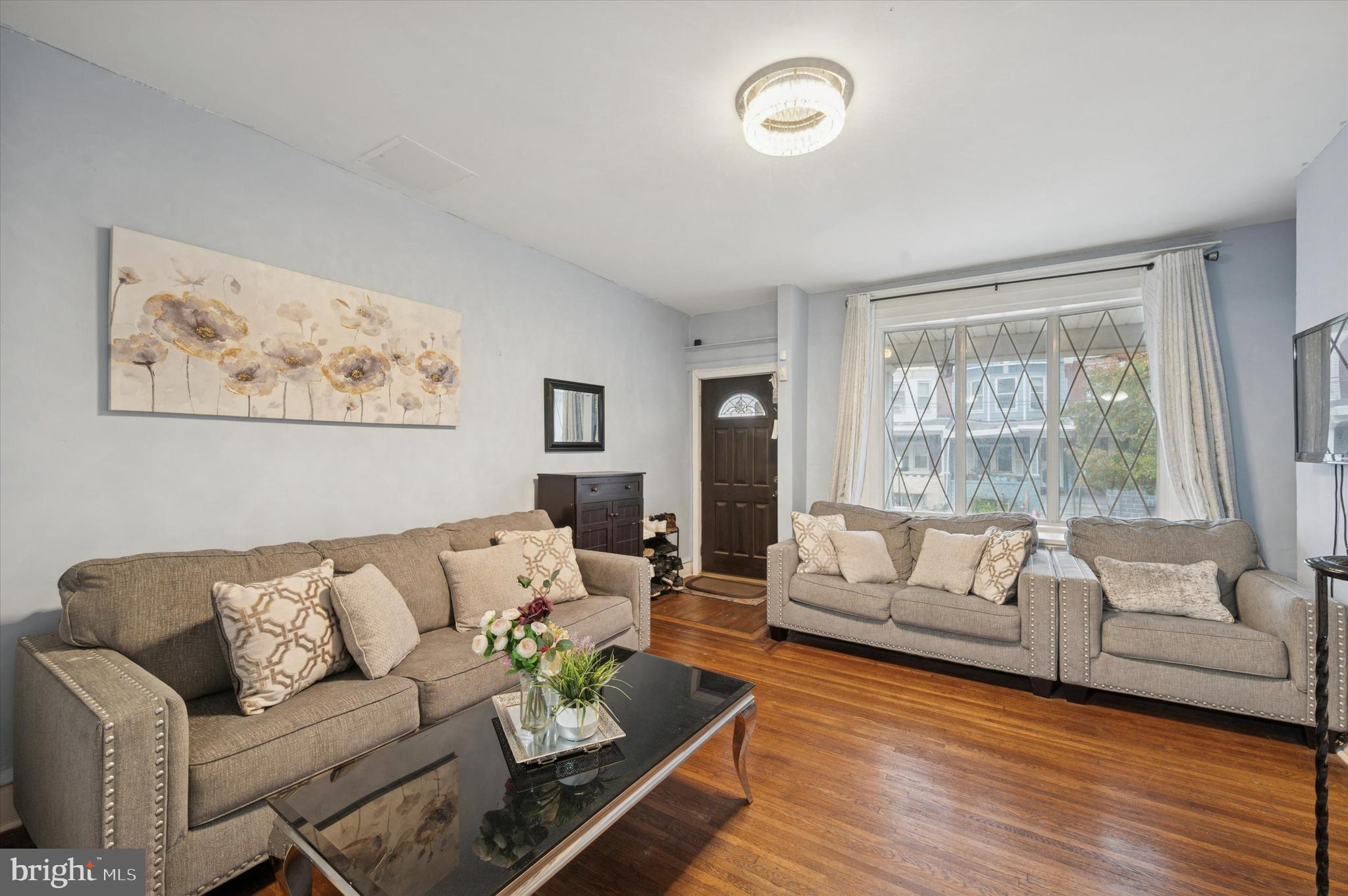 6105 Locust Street Philadelphia, PA 19139 - Photo 3 of 15 a living room with furniture and a large window