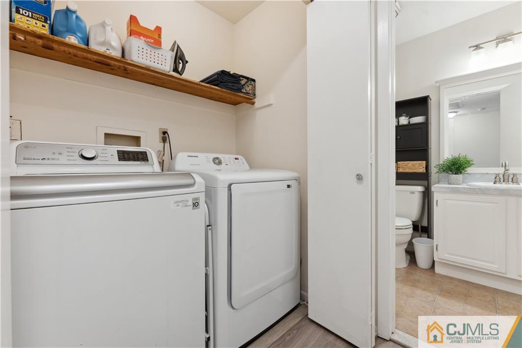 11 Kyle Street Manville, NJ 08835 - Photo 13 of 16 a utility room with dryer and washer