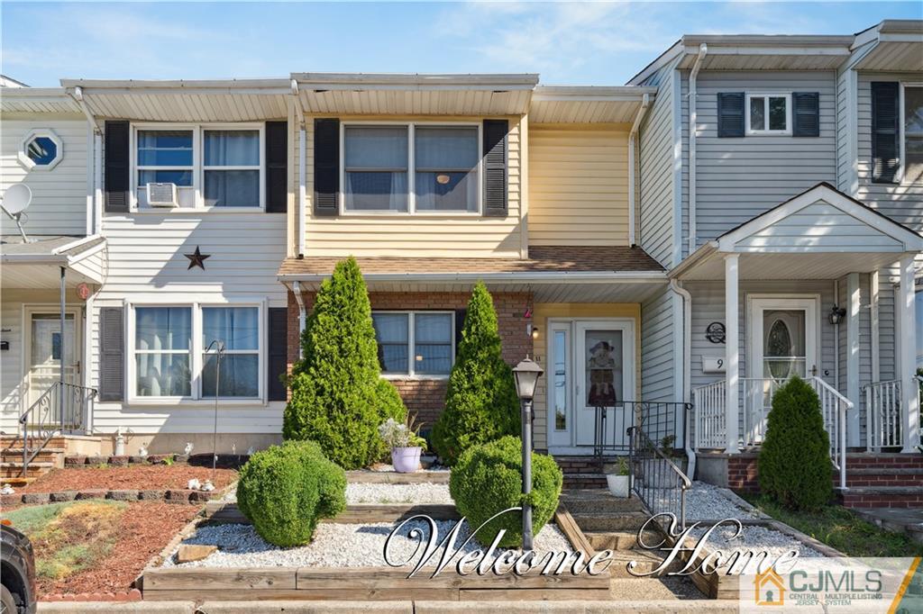 11 Kyle Street Manville, NJ 08835 - Photo 2 of 16 a front view of a house with garden