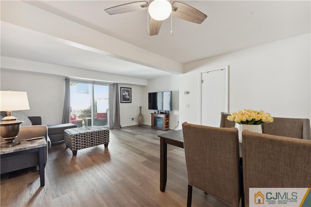 11 Kyle Street Manville, NJ 08835 - Photo 3 of 16 a living room with furniture and a wooden floor