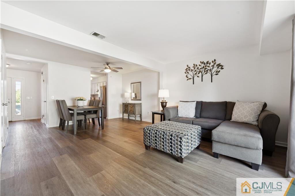 11 Kyle Street Manville, NJ 08835 - Photo 7 of 16 a living room with furniture and wooden floor