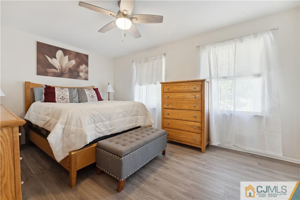 11 Kyle Street Manville, NJ 08835 - Photo 8 of 16 a bedroom with a bed and a dresser