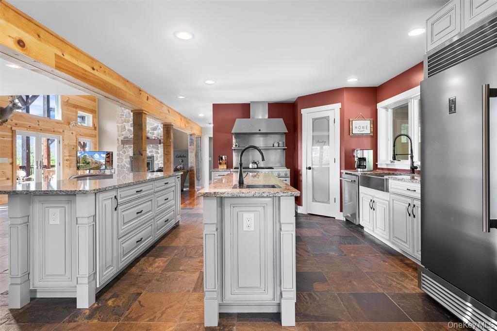 535 County Rte 22 Parish, NY 13131 - Photo 12 of 35 a large kitchen with stainless steel appliances kitchen island granite countertop a large counter top and sink
