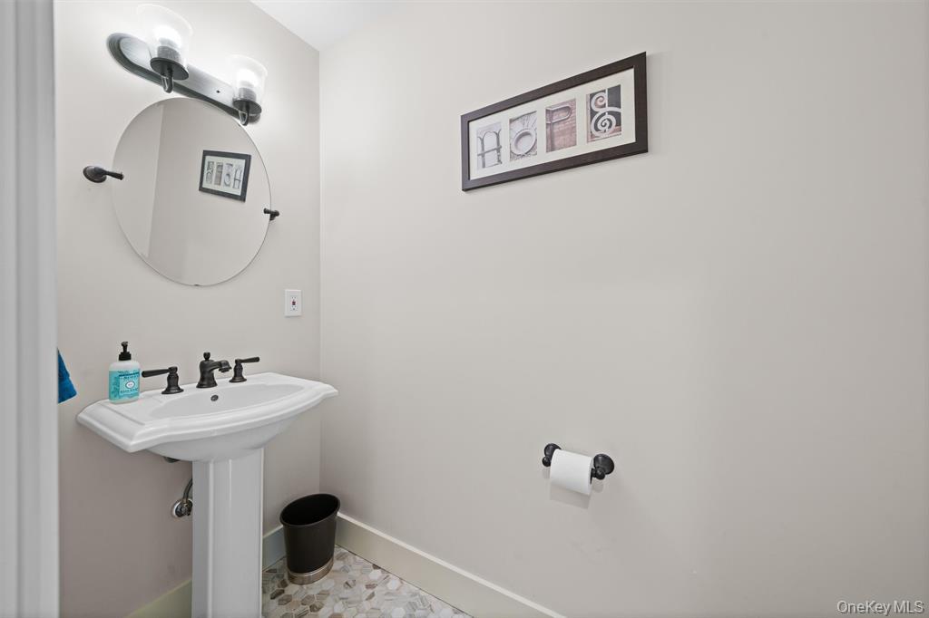 535 County Rte 22 Parish, NY 13131 - Photo 17 of 35 a bathroom with a sink and mirror