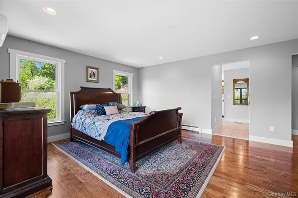 a bedroom with a bed and a fireplace