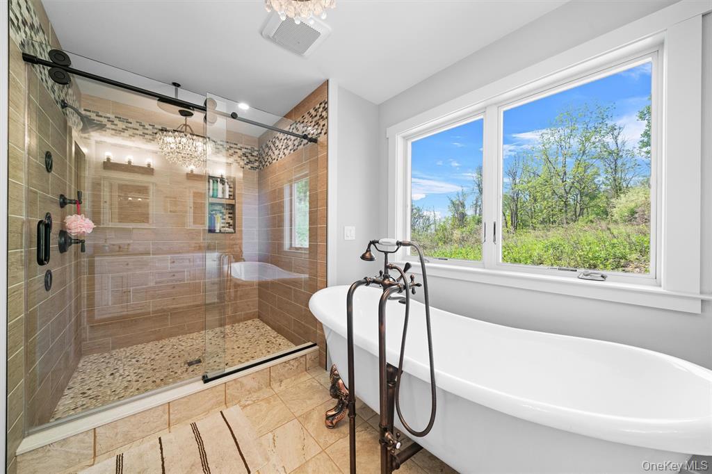 535 County Rte 22 Parish, NY 13131 - Photo 22 of 35 a bathroom with a tub shower and window