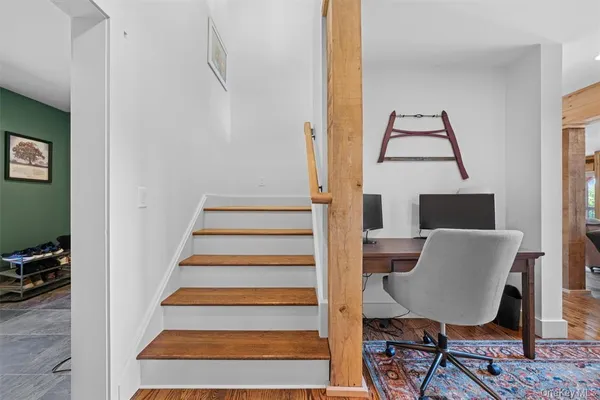 a view of balcony with wooden floor