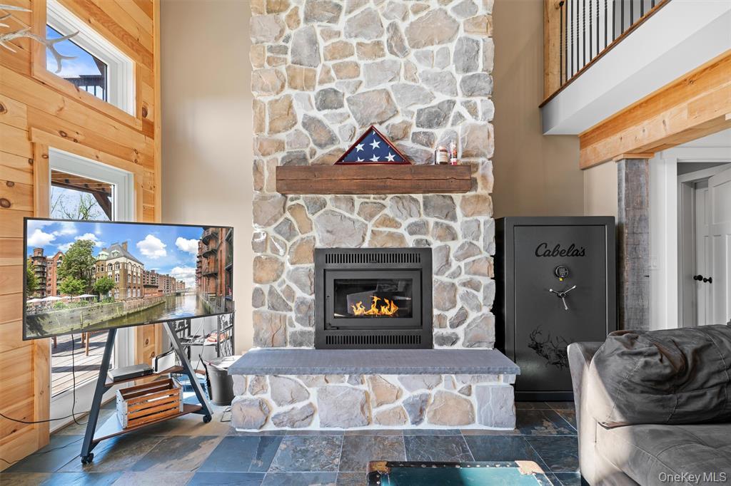 535 County Rte 22 Parish, NY 13131 - Photo 7 of 35 a living room with furniture a flat screen tv and a fireplace