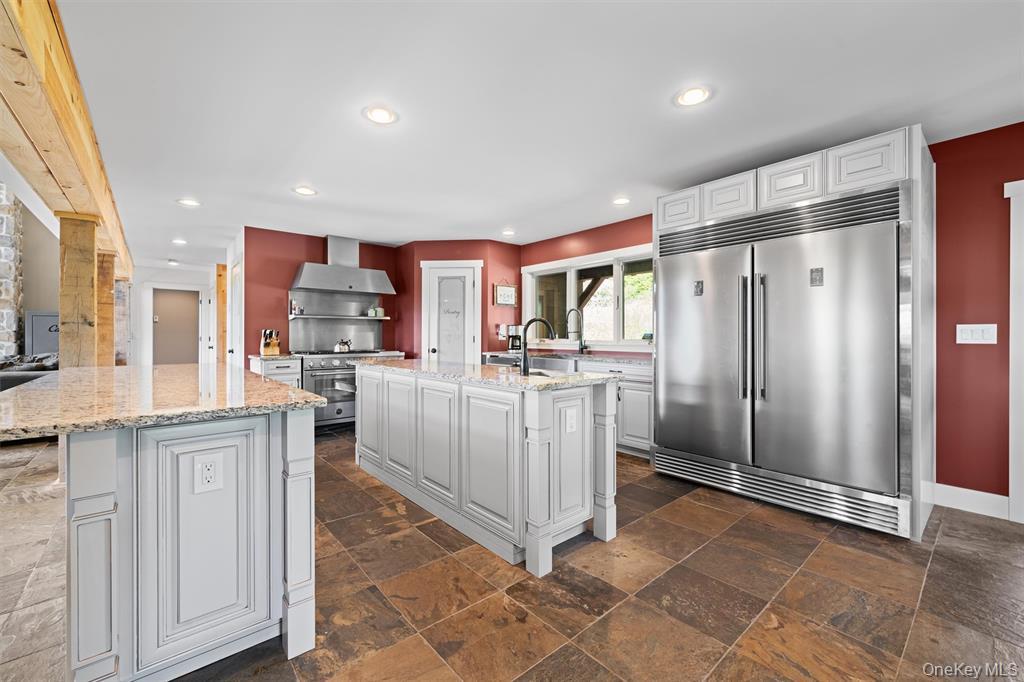 535 County Rte 22 Parish, NY 13131 - Photo 10 of 35 a kitchen with white cabinets and stainless steel appliances