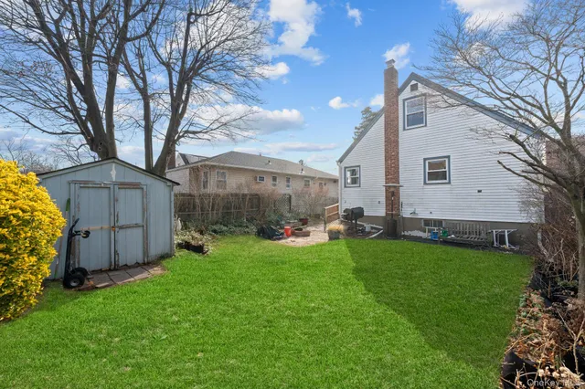a bedroom with a bed and a chair