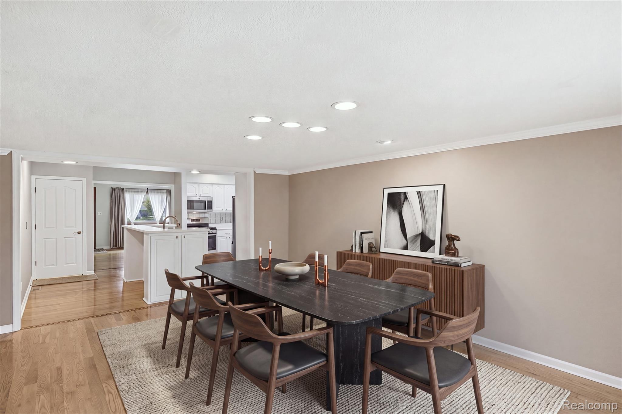 1087 Collingwood Drive Rochester, MI 48307 - Photo 20 of 56 Recessed lighting, crown molding, wood-finish flooring, white trim, and a white interior door