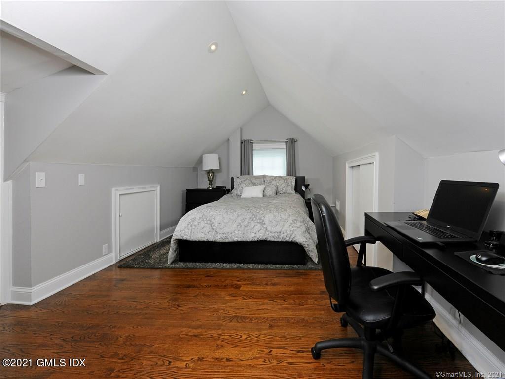18 William Street, Unit WEST Greenwich, CT 06830 - Photo 11 of 21 a bedroom with a bed and a desk