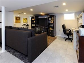 18 William Street, Unit WEST Greenwich, CT 06830 - Photo 15 of 21 a living room with furniture and a flat screen tv