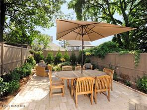 18 William Street, Unit WEST Greenwich, CT 06830 - Photo 16 of 21 a view of backyard with seating space and wooden fence