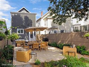 18 William Street, Unit WEST Greenwich, CT 06830 - Photo 17 of 21 a view of a patio with table and chairs potted plants and a large tree