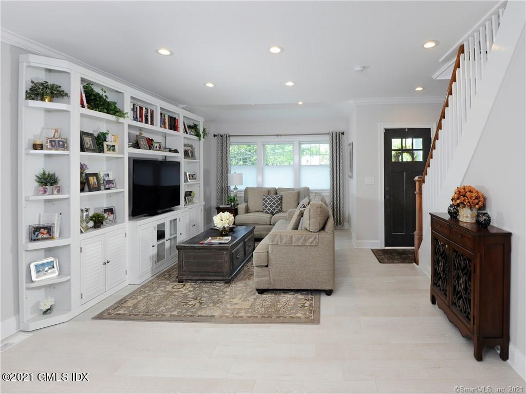 18 William Street, Unit WEST Greenwich, CT 06830 - Photo 2 of 21 a living room with furniture and a flat screen tv
