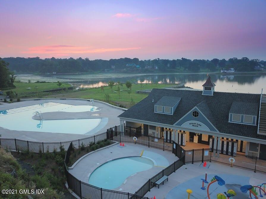 18 William Street, Unit WEST Greenwich, CT 06830 - Photo 21 of 21 an aerial view of a house with swimming pool and mountain view